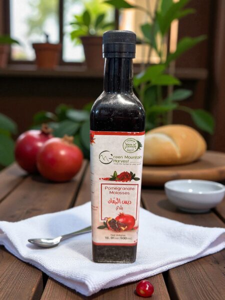 A bottle of Pomegranate Molasses placed on a white towel on a wooden table